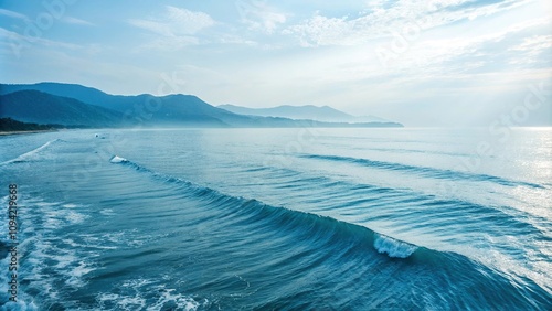 Serene and tranquil blue sea landscape with wavy lines and soft focus, serene blue sea, vast ocean, soothing colors,