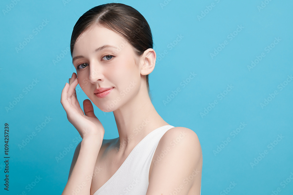Beautiful young woman with clean fresh skin on blue background, Face care, Facial treatment, Cosmetology, beauty and spa, women portrait. Beautiful young woman with clean fresh skin on blue background, Face care, Facial treatment, Cosmetology, beauty and spa, women portrait.