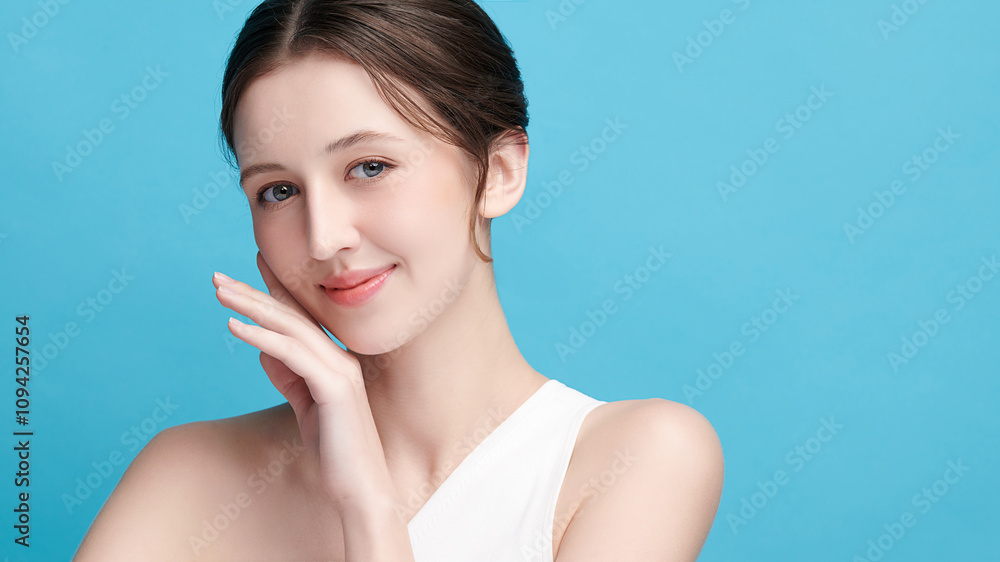 Beautiful young woman with clean fresh skin on blue background, Face care, Facial treatment, Cosmetology, beauty and spa, women portrait. Beautiful young woman with clean fresh skin on blue background, Face care, Facial treatment, Cosmetology, beauty and spa, women portrait.