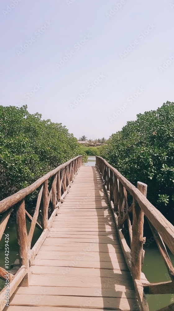 A wooden bridge leads through lush greenery, inviting exploration of the natural surroundings. A wooden bridge leads through lush greenery, inviting exploration of the natural surroundings.