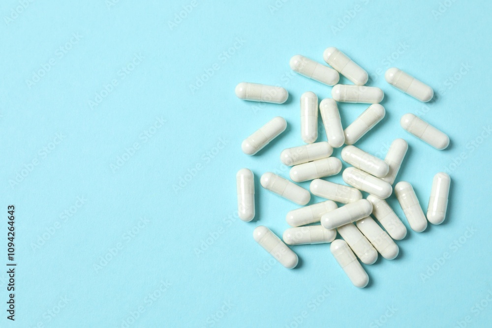 White capsules on a color background White capsules on a color background