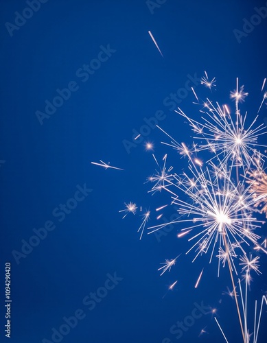 sparkler on a blue background vertical picture, new year 2025