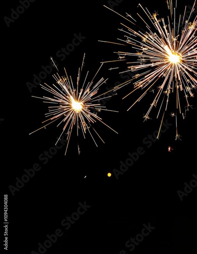 Wallpaper Mural New Year's sparkler or fireworks on a black background, Hand holding burning Sparkler blast on a black bokeh background at night,holiday celebration event party,dark vintage tone Torontodigital.ca