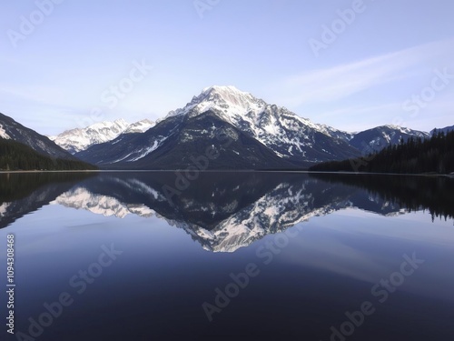 Reflections of Mount Shuksan's rugged peaks mirrored in a still lake, wilderness, landscape