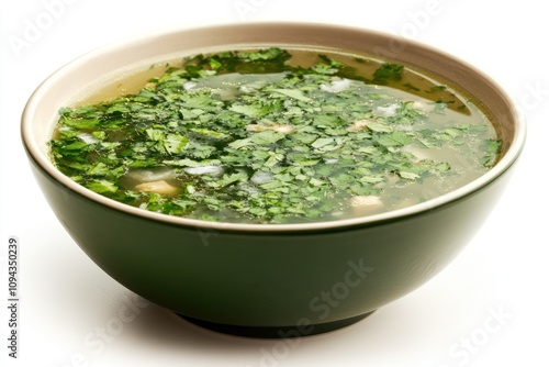 A bowl of soup garnished with fresh herbs, likely served as a comforting dish.