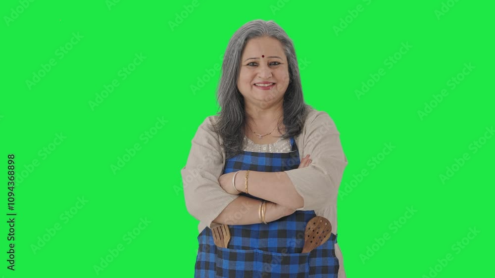 Happy Indian aged housewife standing crossed hands Green screen Happy Indian aged housewife standing crossed hands Green screen