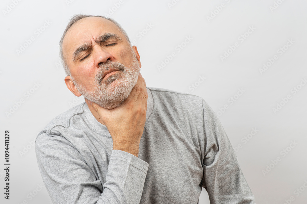 Obraz premium Mature man clutching his neck, throat. Complicated breathing, asthma or thyroid gland symptoms, suffering from throat pain..
