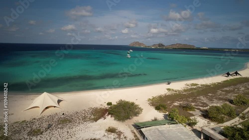 Pristine isla madrisky beach and turquoise caribbean waters under a sunny sky, aerial view photo