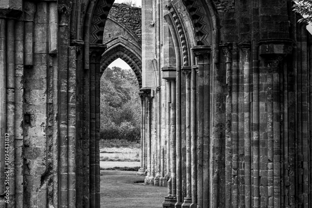 Black and white photo of an ancient building with intricate architecture Black and white photo of an ancient building with intricate architecture