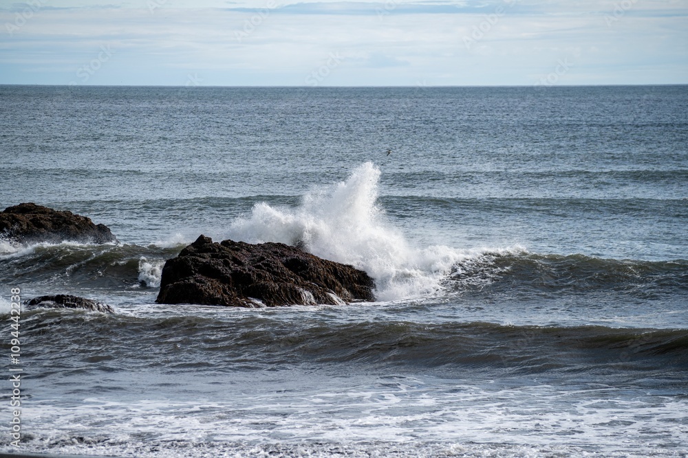 Waves crashing against ocean rocks Waves crashing against ocean rocks
