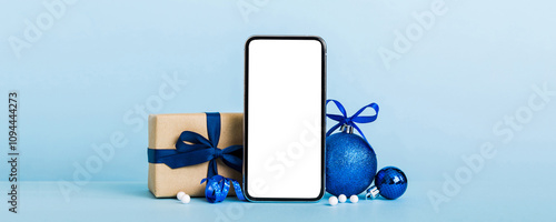 Digital phone mock up with rustic Christmas decorations for app presentation with empty space for you design. Christmas online shopping concept. Tablet with copy space on colored background photo