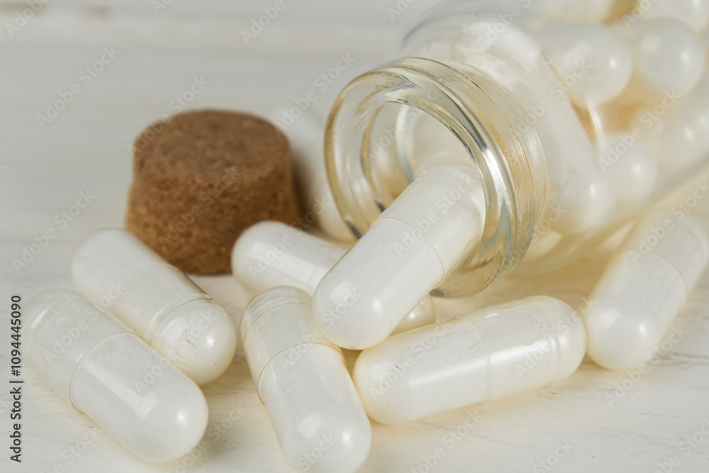 Vitamin capsules and dietary supplements on a light background. Vitamin capsules and dietary supplements on a light background.