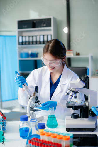 Scientists in lab coats collaborating with test tubes, flasks, and microscopes in a modern lab.