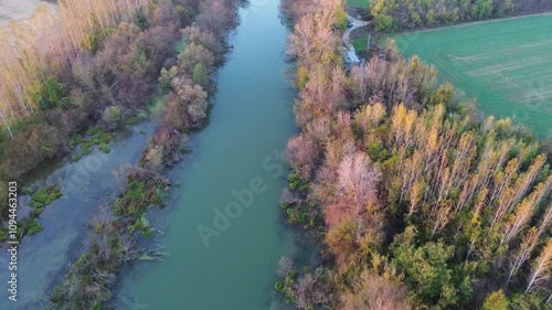 Panorama of Small Danube river from drone at sunset with gren fields and sun, Slovakia