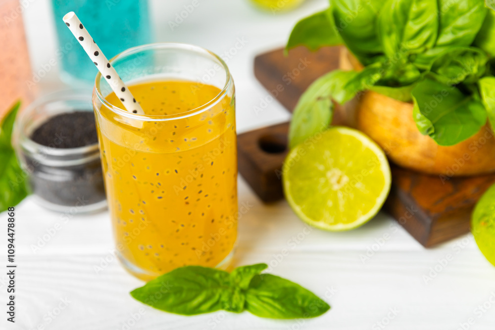 Fototapeta premium Diet detox cocktail with basil and chia seeds in a glass jar and a glass on a textured background. Drink with seeds. Health food. Detox cocktail. Antioxidant. Water with basil. Space for text. 