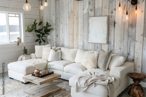 Modern rustic living room interior design with whitewashed wood walls, a cozy sectional in cream tones, and soft lighting from Edison-style bulbs. photo