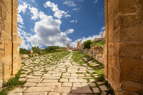 Roman ruins (against the background of a beautiful sky with clouds) in the Jordanian city of Jerash (Gerasa of Antiquity), capital and largest city of Jerash Governorate, Jordan #1094495017