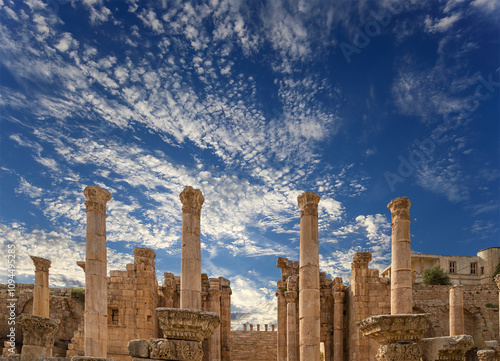 Roman ruins (against the background of a beautiful sky with clouds) in the Jordanian city of Jerash (Gerasa of Antiquity), capital and largest city of Jerash Governorate, Jordan #1094495285