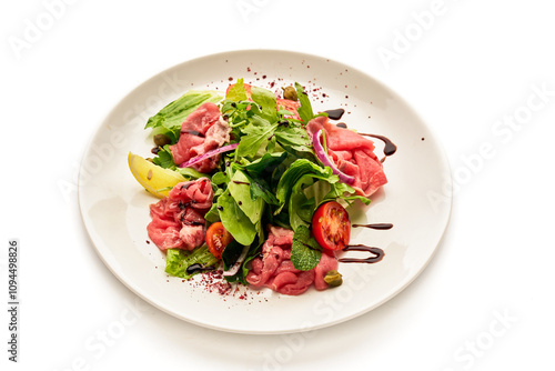 A plate of food with a variety of vegetables and meat