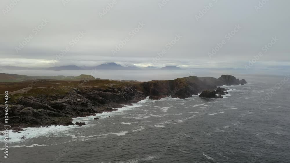 AAerial Ascend of Malin Head’s Rugged Coast on a Foggy Morning AAerial Ascend of Malin Head’s Rugged Coast on a Foggy Morning