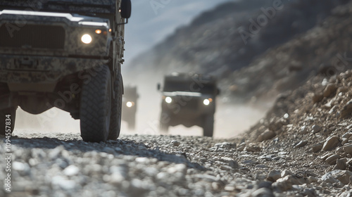 Military Convoy Transporting Medical Equipment in Rugged Terrain photo