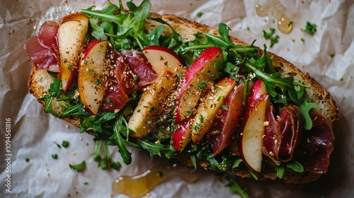 Delicious appetizers with fresh apples and greens on crunchy bread arranged f...