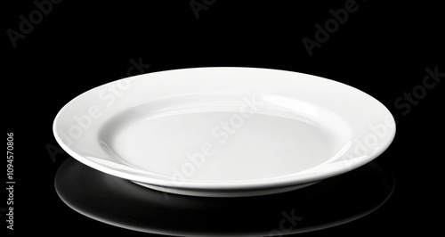 Simple white plate with a smooth finish for dining and serving culinary creat...