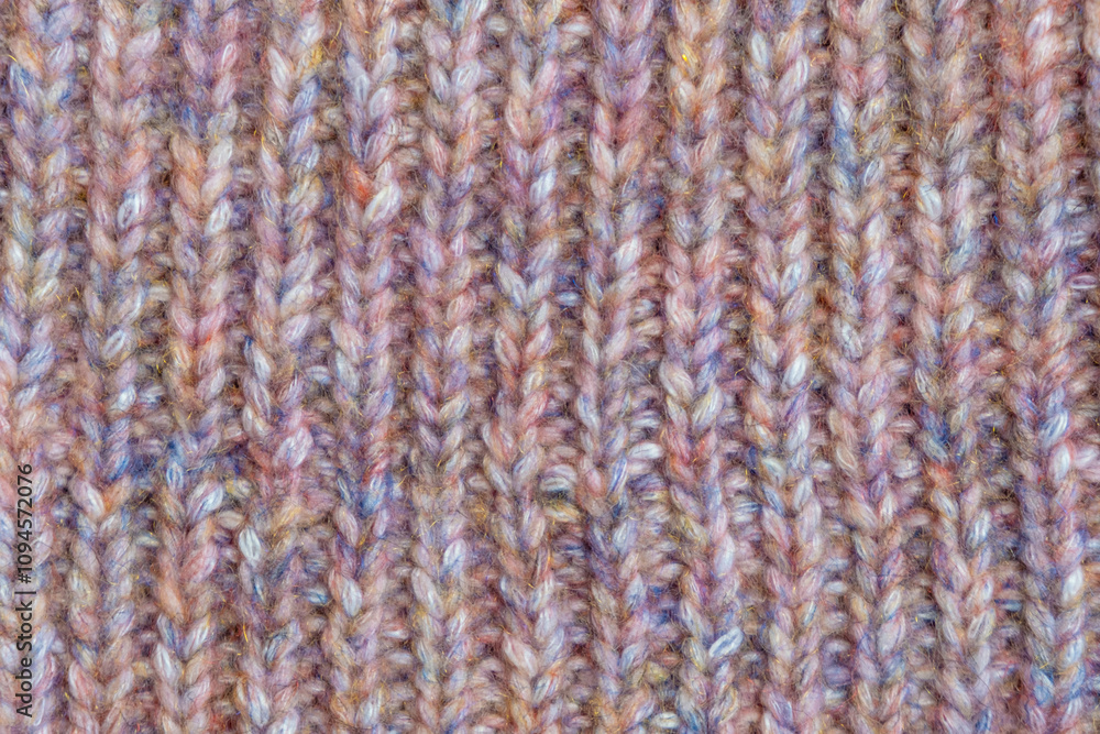 Close-up of texture thick knitted woolen yarn of pink. Winter texture concept, knitted clothing. Machine knitted woolen goods. Close-up of texture thick knitted woolen yarn of pink. Winter texture concept, knitted clothing. Machine knitted woolen goods.