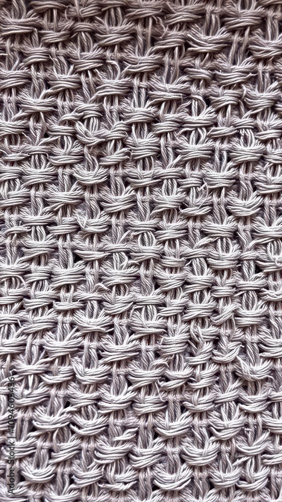 Close-up shot of a intricately patterned textured fabric, material Close-up shot of a intricately patterned textured fabric, material