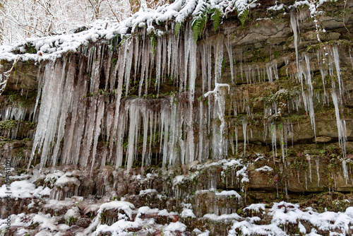 icicles hanging from a cliff on a winter morning