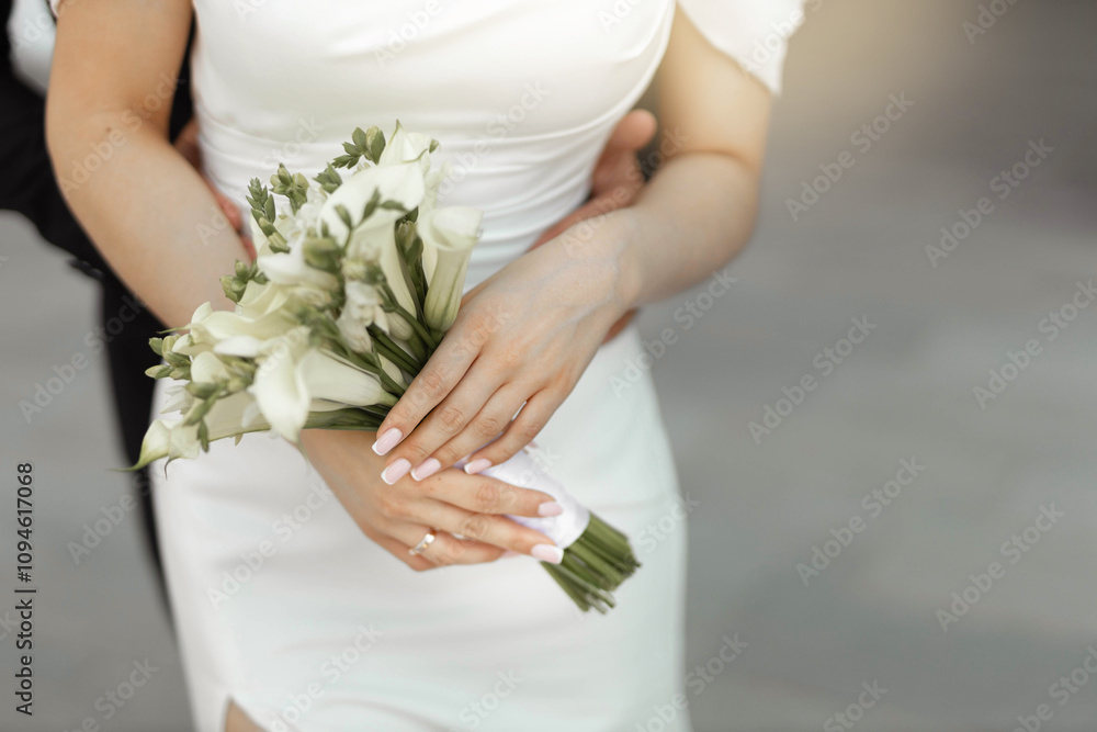 stylish wedding bouquet of fresh flowers in the hands of the bride stylish wedding bouquet of fresh flowers in the hands of the bride