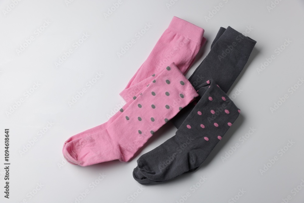 Different child's tights on white background, top view Different child's tights on white background, top view