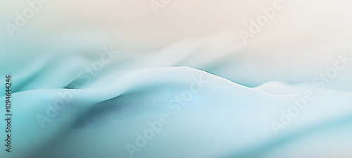 Soft and elegant abstract background with a smooth gradient of light blue and white, enhanced by a subtle grainy texture