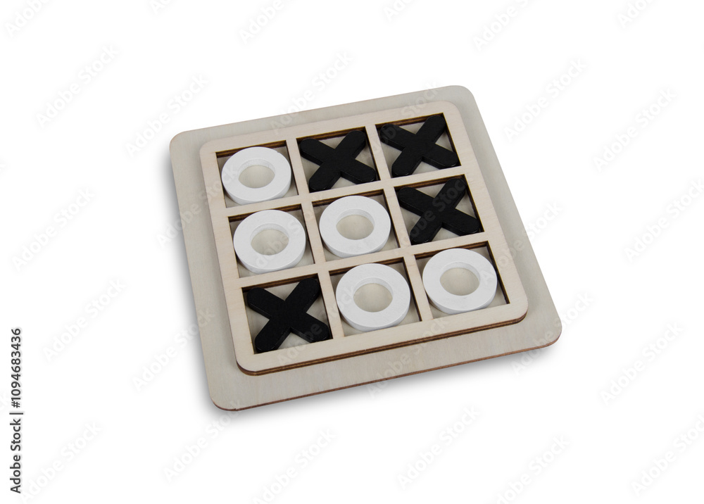 A wooden game set of noughts and crosses on a black background, tic-tac-toe