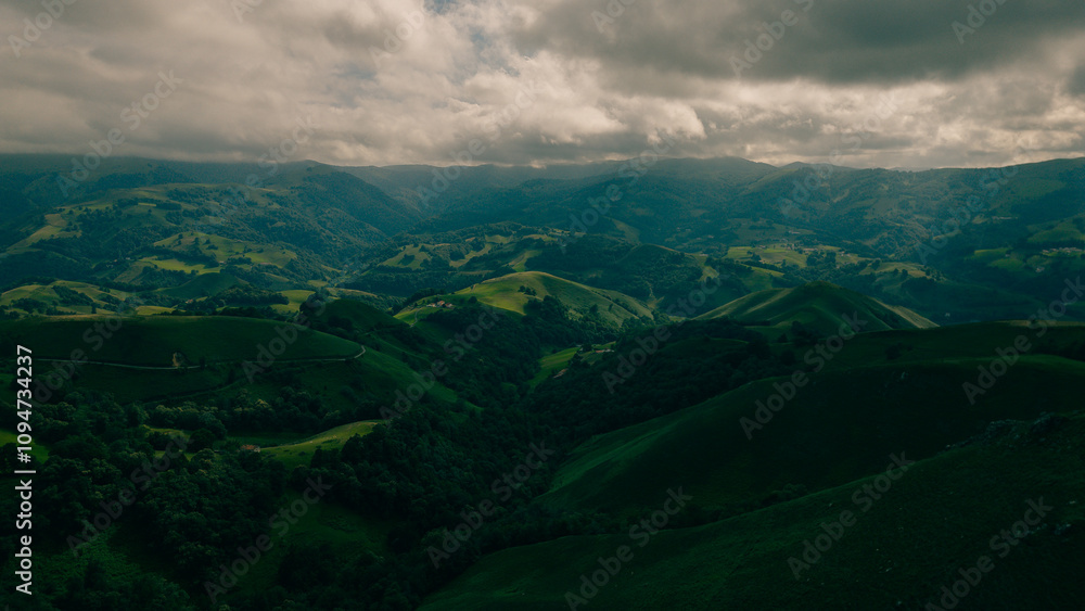 A breathtaking view of lush green hills unfolds, capturing the serenity of the French Pyrenees on the Camino de Santiago. A breathtaking view of lush green hills unfolds, capturing the serenity of the French Pyrenees on the Camino de Santiago.