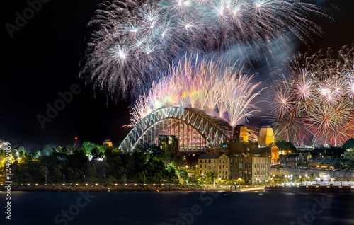 Photography Sydney Harbour Bridge New Years Eve fireworks, colourful NYE fire works lighting the night skies with vivid multi colours NSW Australia