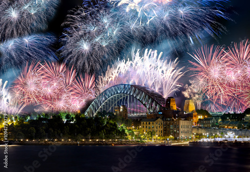 Sydney Harbour Bridge New Years Eve fireworks, colourful NYE fire works lighting the night skies with vivid multi colours NSW Australia. 