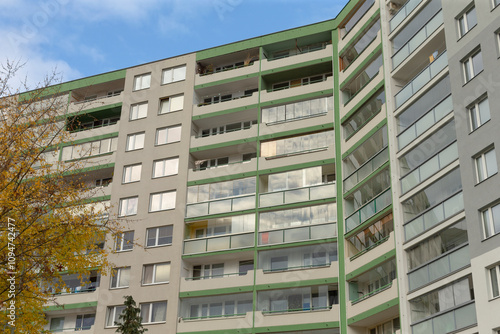 An urban residential complex showcasing numerous glassfronted balconies for a modern living experience photo