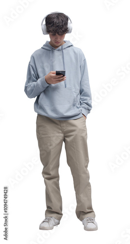 Teenager standing and using a smartphone