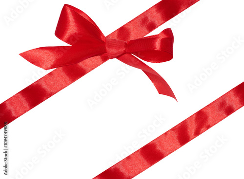 Tied bow made of red silk ribbon on an isolated background, decor for a gift photo