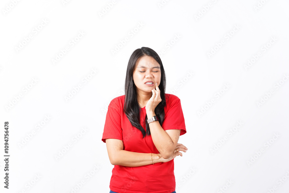 beautiful Asian woman shows a toothache pose, holding her cheek with a pained expression against a white background beautiful Asian woman shows a toothache pose, holding her cheek with a pained expression against a white background