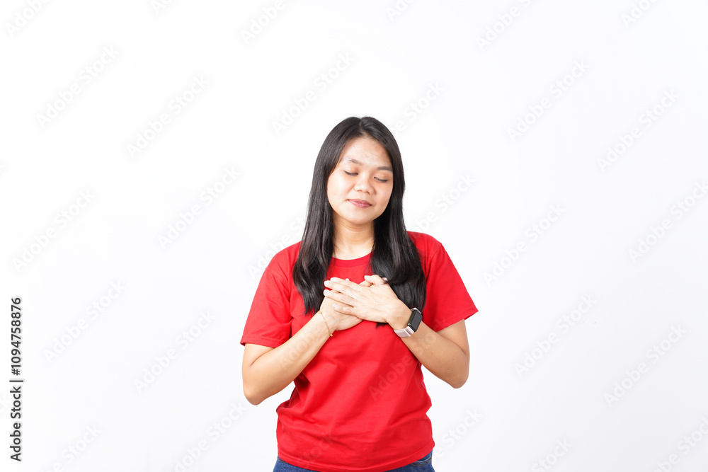 beautiful Asian woman strikes a self-improvement pose, holding her chest, set against a white background beautiful Asian woman strikes a self-improvement pose, holding her chest, set against a white background