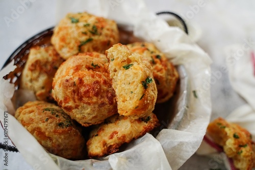 Homemade cheddar biscuits topped with garlic butter and parsley