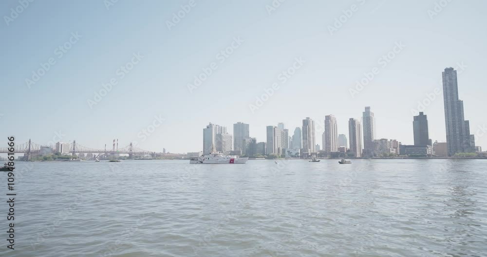 NYC Patrol Boat, Boats, Long Island City Skyline Pan Left to East Side Manhattan Skyline - 4K 48fps ProRes NYC Patrol Boat, Boats, Long Island City Skyline Pan Left to East Side Manhattan Skyline - 4K 48fps ProRes