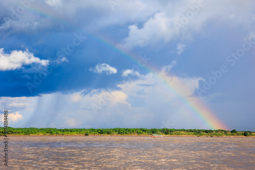 Rainbow in the amazon sky, over the great amazon river, Iquitos Peru