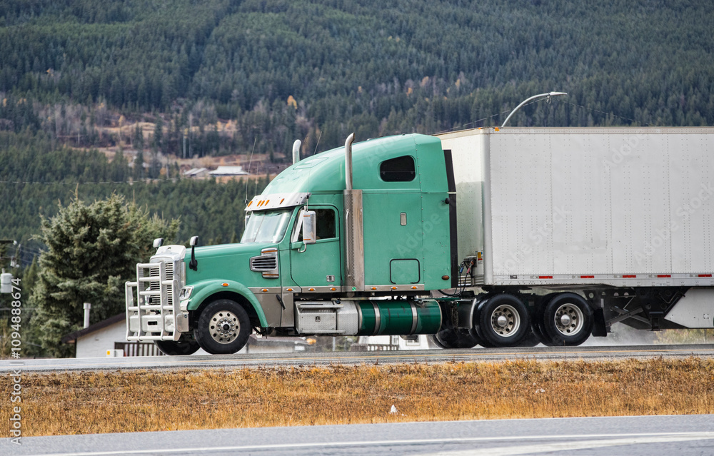 Heavy Cargo on the Road. A truck hauling freight along a highway. Taken in Alberta, Canada Heavy Cargo on the Road. A truck hauling freight along a highway. Taken in Alberta, Canada