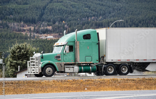 Heavy Cargo on the Road. A truck hauling freight along a highway. Taken in Alberta, Canada