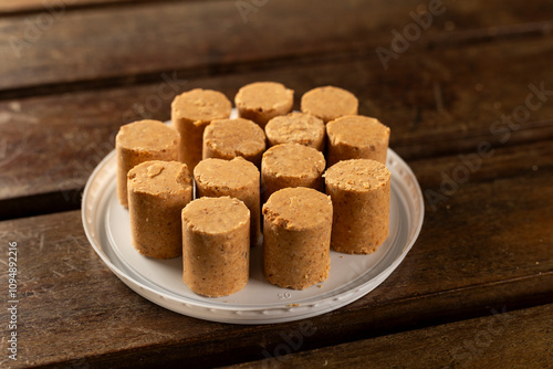 Sweet Brazilian Peanut Called Paçoca on a wooden desk