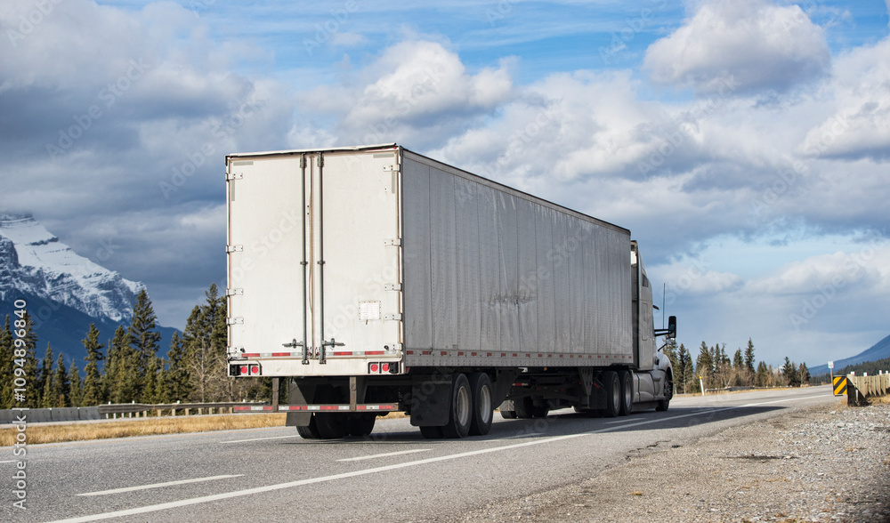 Heavy Cargo on the Road. A truck hauling freight along a highway. Taken in Alberta, Canada Heavy Cargo on the Road. A truck hauling freight along a highway. Taken in Alberta, Canada