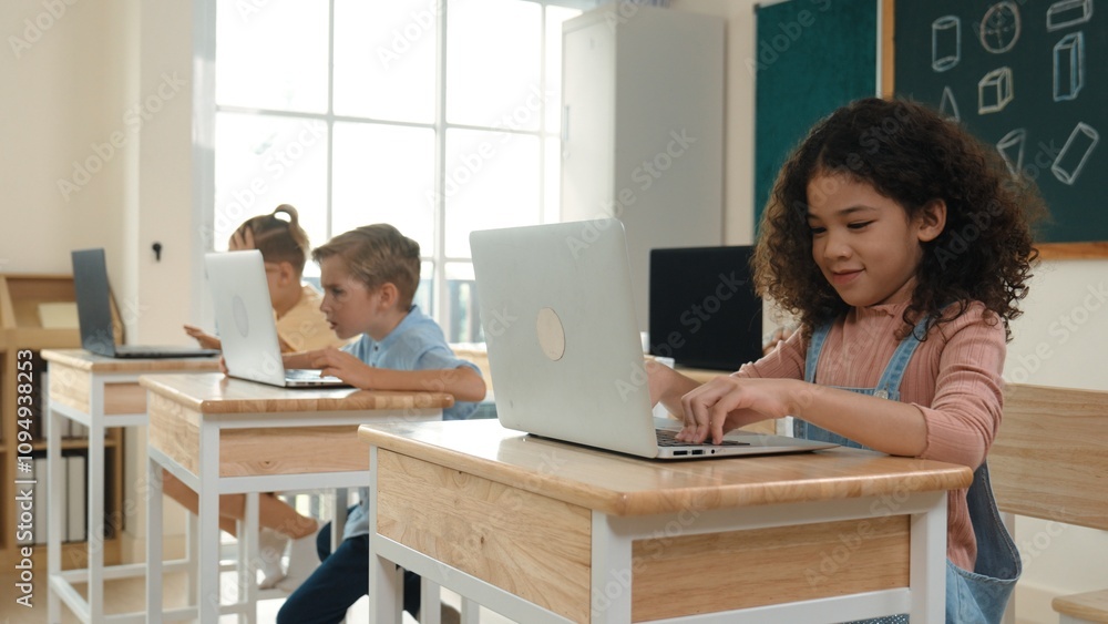 American girl learning about coding engineering prompt while diverse students sitting at STEM technology class. Multicultural children working on laptop to generated AI by using software. Pedagogy.